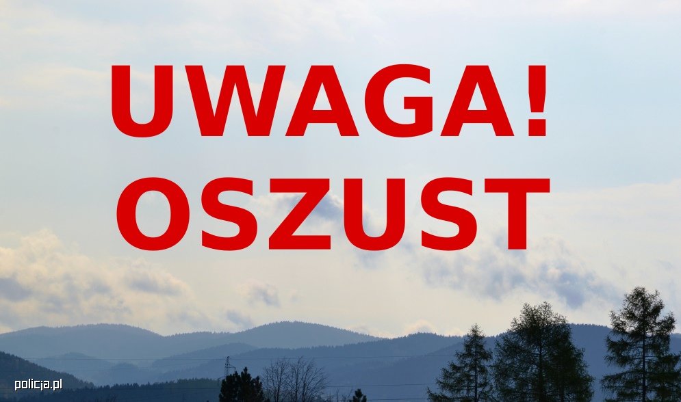 Czerwony napis "Uwaga! oszust". W tle góry.